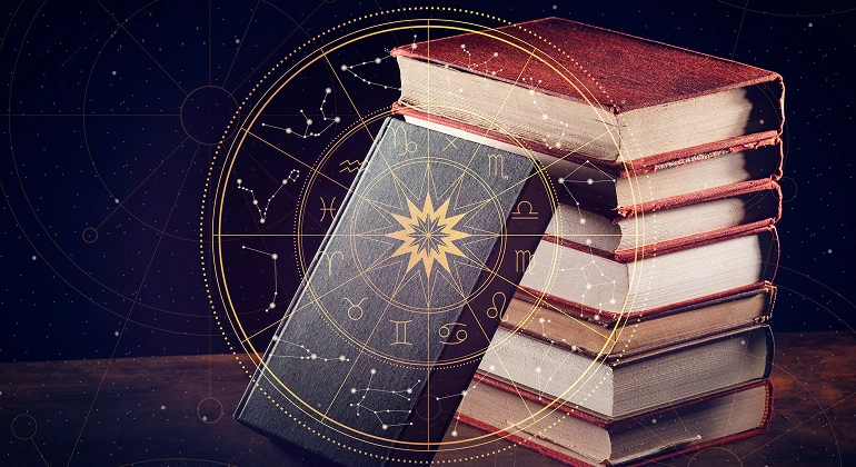 "Stack of ancient astrology books with zodiac signs and horoscope symbols — representing Vedic astrology knowledge and horoscope study.