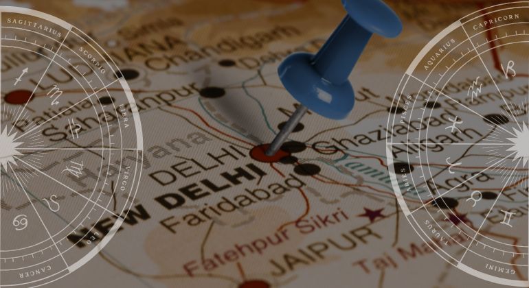 Map of North India with pin on New Delhi, symbolizing famous astrologer near me with zodiac overlays