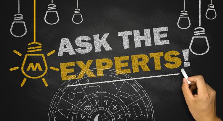 Ask the Experts text on chalkboard with zodiac wheel and glowing lightbulbs illustration